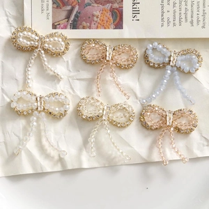 Handmade beaded bow earrings with sparkling crystals and rhinestones in various colors