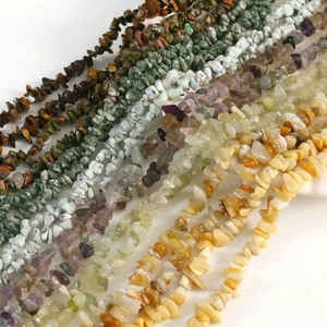 Natural irregular gemstone beads including tiger eye, amethyst, and white turquoise