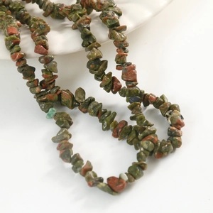 Macro detail of unakite natural stone chips with green and red mineral textures