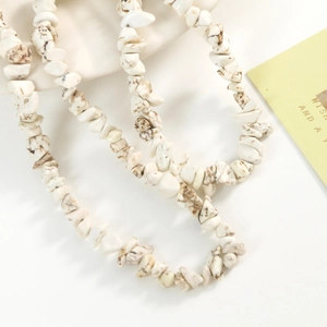 Close-up of irregular natural white turquoise stone beads for DIY jewelry making