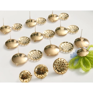 Macro view of gold-plated copper earring stud bases with mesh disc for DIY jewelry making