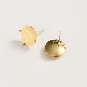 Close-up of gold-plated 4-prong earring studs findings for DIY jewelry making