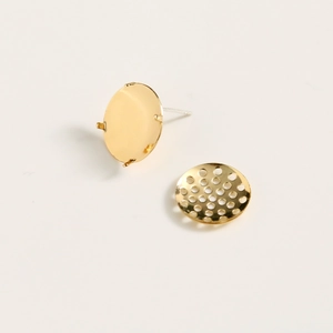 Detail of gold-plated copper earring base and hollow metal disc for DIY jewelry making