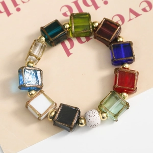 Handmade colorful square glass bead bracelet with gold-edged detailing and metal accents