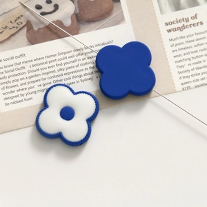 Macro shot of blue and white floral acrylic beads for DIY jewelry making and bracelets