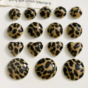 Variety of leopard print resin flatback charms in round and heart shapes for DIY jewelry