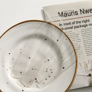 Minimalist clear acrylic long curved DIY accessories set on elegant ceramic plate