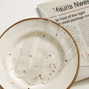 Macro detail of transparent curved acrylic craft pieces for DIY photography props