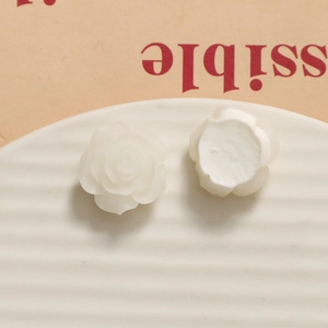 Macro detail of white resin rose petals with textured layering for DIY accessories