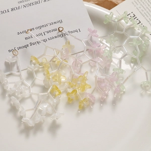 Translucent flower bead charms in macabre colors with gold loops for DIY jewelry making