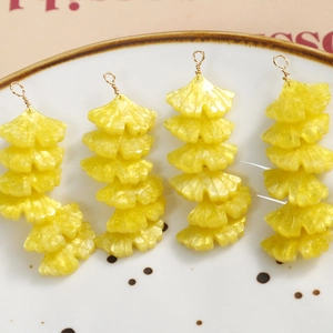 Handmade yellow resin ginkgo leaf pendants with glitter and metallic wire wrap