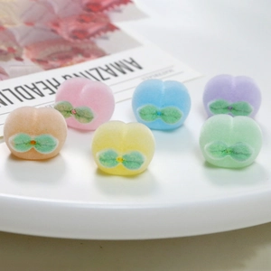Mini fuzzy peach charms in assorted macaron colors for DIY jewelry and hair accessories