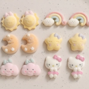 Detailed view of flocked cartoon cloud rainbow and star resin charms for DIY jewelry making