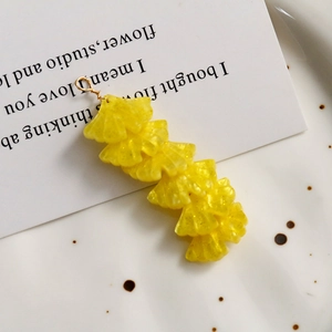 Detail of yellow ginkgo leaf pendants with gold glitter and metallic loop rings