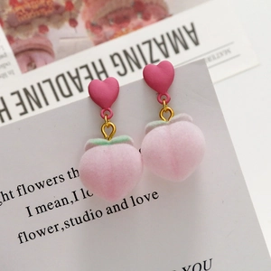 Sweet pink plush peach heart drop earrings with soft flocking and gold-tone hooks