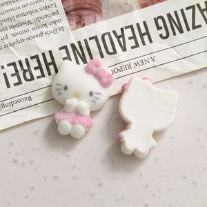 Detailed macro view of Hello Kitty flocked resin charms with soft velvet texture for DIY crafts