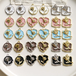 Macro shot of assorted colorful enamel rose heart charms for DIY jewelry making