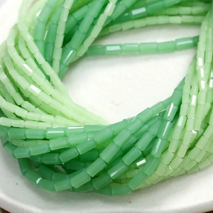Macro shot of green faceted cylindrical beads for DIY jewelry and handcrafted accessories