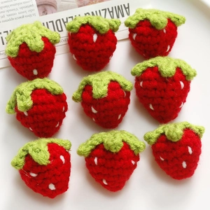 Handmade crochet strawberry charms for DIY jewelry and accessories in a grid set