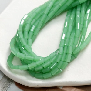 Polished mint green faceted tube beads for DIY jewelry and accessory making