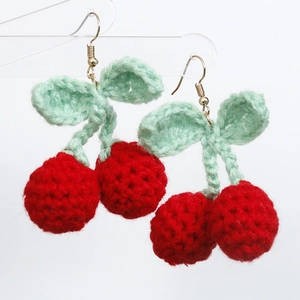 Handmade crochet cherry drop earrings with red knitted fruits and green leaf details