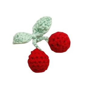 Handmade crochet cherry charms with red knit balls and green leaves for DIY accessories