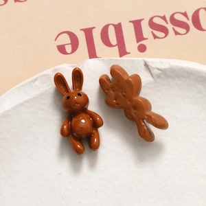 Detail view of 3D brown rabbit resin charms for DIY jewelry and phone case making