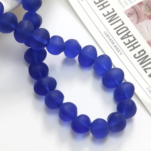 Detail showing dark blue frosted glass heart beads for DIY jewelry making and crafts