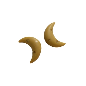 Matte crescent moon resin earrings in vintage mustard yellow with gold star studs