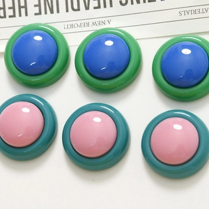 Flat lay of colorful resin round cabochon charms for DIY jewelry and hair accessories