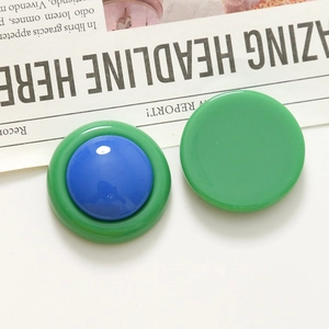 Detailed view of round candy-colored resin jewelry components with glossy finish