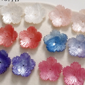 Macro view of cherry blossom DIY acrylic pendants with glitter finish and center holes