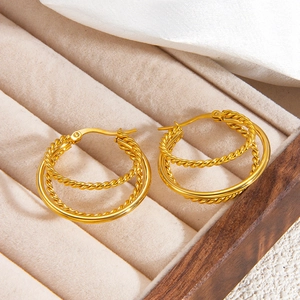 Chic 18k gold triple layered hoop earrings with twisted rope and polished metal texture