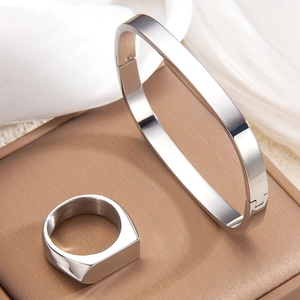 Polished silver irregular square bangle and matching ring set in minimalist 18k style