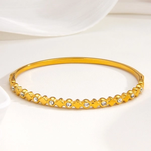 Goldenes Kleeblatt Armreif für Damen mit Zirkonia-Steinen im eleganten Retro-Design