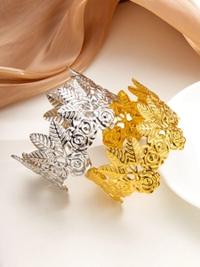 Detailed view of wide 18k gold and silver plated rose relief textured open bracelets