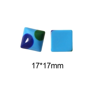 Macro detail of 17x17mm square resin craft tiles with retro colorful polka dot patterns