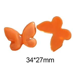 Détail des accessoires papillon en résine translucide orange vif mesurant 34x27mm pour DIY