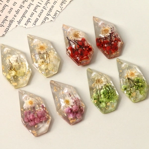 Clear resin faceted pendants with dried flowers pearls and gold foil for DIY jewelry