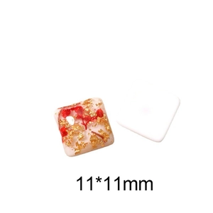 Detail view of 11x11mm square resin charms with red dried flowers and gold leaf foil