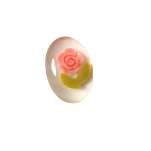 Oval resin flower charm with pink rose and green leaves on pearl texture background
