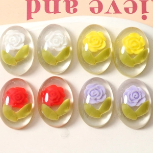 Detailed view of eight transparent oval resin rose charms for DIY jewelry accessories