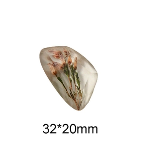 Detail of transparent resin gem with dried lavender flowers, dimensions 32x20mm
