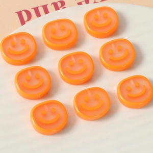 DIY translucent orange smiley face resin charms for earrings and hair clip accessories