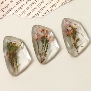 Transparent faceted resin gems with dried flowers for DIY jewelry making and crafts