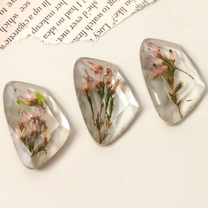 Set of three faceted resin charms with embedded real dried flowers for DIY jewelry making