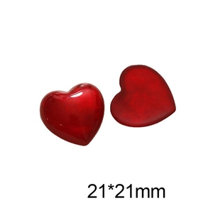 Detail view of 21x21mm red resin heart charms for DIY jewelry and crafts making