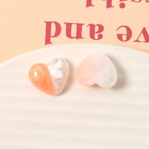DIY resin heart charms with marble texture and glitter for jewelry making
