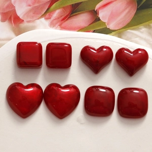 Glossy deep red resin heart and square DIY accessories for jewelry making in flat lay