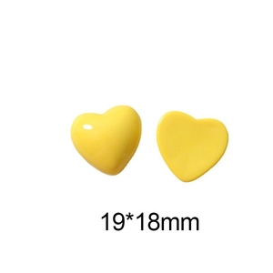 Detailed view of yellow resin heart accessory with glossy finish, size 19x18mm